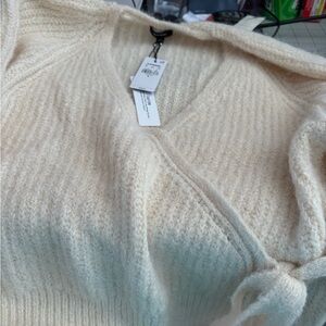 Express XL soft sweaters, one cream color and one light pink.